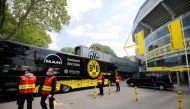 The Borussia Dortmund team coach arrives outside the stadium before the match, following the outbreak of the coronavirus disease (COVID-19) REUTERS/Leon Kuegeler DFL regulations prohibit any use of photographs as image sequences and/or quasi-video