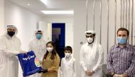 Ashraf Abu Issa (left), Chairman of Abu Issa Holding and its subsidiary, Toys4Me, with other officials distributing gifts among children who are in quarantine.