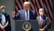 In this file photo taken on May 15, 2020 US President Donald Trump, with Response coordinator for White House Coronavirus Task Force Deborah Birx (L) and Director of the National Institute of Allergy and Infectious Diseases Anthony Fauci (R), speaks on va