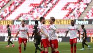 Cologne's Austrian midfielder Florian Kainz (R) celebrates scoring the 2-0 goal with his teammate Cologne's German midfielder Dominick Drexler during the German first division Bundesliga football match FC Cologne v Mainz 05 on May 17, 2020 in Cologne, wes