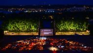  Spectators in their vehicle attend a drive-in movie screening of Hippocrates by French director Thomas Lilti, on Place des Quinconces in Bordeaux, on May 16, 2020 as part of the Drive-in Festival featuring 10 movies in 10 days, while the cinemas in Franc