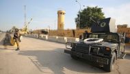  In this file photo taken on January 2, 2020 Iraqi counter-terrorism forces stand guard in front of the US embassy in the capital Baghdad. AFP / AHMAD AL-RUBAYE
