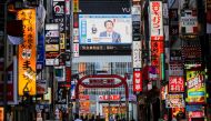 A large screen on a building shows live broadcasting of Japan's Prime Minister Shinzo Abe's news conference on Japan's response to the coronavirus disease (COVID-19) at Kabukicho entertainment district in Tokyo, Japan May 14, 2020. REUTERS/Issei Kato
