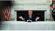 :U.S. President Donald Trump talks about taking daily doses of hydroxychloroquine pills as he addresses a coronavirus disease (COVID-19) pandemic meeting with restaurant executives and industry leaders in the State Dining Room at the White House in Washin