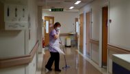 Domestic Jane Shackleton mops the floor on the Postnatal Ward at the Lancashire Women and Newborn Centre at Burnley General Hospital in East Lancashire, following the outbreak of the coronavirus disease (COVID-19), in Burnley, Britain, May 15, 2020. Pictu