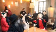 Mannequins are placed to provide social distancing at a restaurant in Vilnius, Lithuania on May 21, 2020 amid the novel coronavirus COVID-19 pandemic. AFP / PETRAS MALUKAS 