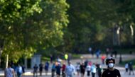People exercise at the Retiro Park in Madrid on May 25, 2020 as the gates of the capital's parks reopen as coronavirus lockdown measures will finally be eased for people in Madrid and Barcelona. AFP / Gabriel Bouys 