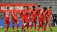 Bayern Munich's Alphonso Davies celebrates scoring their fourth goal with teammates, as play resumes behind closed doors following the outbreak of the coronavirus disease (COVID-19) REUTERS/Andreas Gebert/