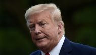 US President Donald Trump walks across the South Lawn upon his return to the White House in Washington, DC on May 27, 2020.  AFP / Olivier DOULIERY