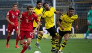 Bayern Munich's German forward Thomas Mueller runs with the ball during the German first division Bundesliga football match BVB Borussia Dortmund v FC Bayern Munich on May 26, 2020 in Dortmund, western Germany.   AFP / Federico GAMBARINI 