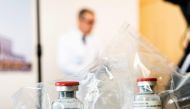 (FILES) In this file photo taken on April 08, 2020, vials of the drug remdesivir sit on a table during a press conference about the start of a study of the Ebola drug in severely ill COVID-19 patients, at the University Hospital Eppendorf in Hamburg, Germ