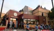 Police officers monitor protests at the Minneapolis Police third precinct after a white police officer was caught on a bystander's video pressing his knee into the neck of African-American man George Floyd, who later died at a hospital, in Minneapolis, Mi