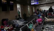 People, part of a group of about 200 Colombians living temporarily at Guarulhos International Airport due to the coronavirus disease (COVID-19) restrictions, sleep at a lobby of the airport, near Sao Paulo, Brazil May 25, 2020. Picture taken May 25, 2020.