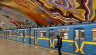 A woman wearing a protective face mask stands on the platform of Osokorky metro station, after the city metro was reopened as part of another stage to ease the coronavirus disease (COVID-19) restrictions in Kiev, Ukraine May 25, 2020. REUTERS/Valentyn Ogi