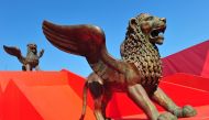 (FILES) In this file photo taken on August 30, 2011 statues of golden lions are displayed near the festival's palace on the eve of the opening of the 68th Venice International Film Festival at Venice Lido. AFP / Alberto PIZZOLI