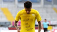 Borussia Dortmund's Jadon Sancho celebrates scoring their second goal with a 'Justice for George Floyd' shirt, as play resumes behind closed doors following the outbreak of COVID-19