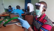 Workers prepare face shields from recycled plastics at the Zaidi Recyclers workshop as a measure to stop the spread of coronavirus disease (COVID-19) in Dar es Salaam, Tanzania May 27, 2020. Picture taken May 27, 2020. REUTERS/Stringer