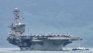 FILE PHOTO: The USS Theodore Roosevelt (CVN-71) is pictured as it enters the port in Da Nang, Vietnam, March 5, 2020. REUTERS/Kham/File Photo
