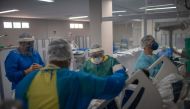 Health professionals take care of a patient at the Intensive Care Unit (ICU) ward where patients infected with the novel coronavirus, COVID-19, are being treated at the Doctor Ernesto Che Guevara Public Hospital in Marica city, state of Rio de Janeiro, Br