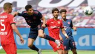 Bayern Munich's Polish forward Robert Lewandowski (C) heads to score his team's fourth goal during the German first division Bundesliga football match Bayer 04 Leverkusen v FC Bayern Munich on June 6, 2020 in Leverkusen, western Germany. ?AFP  / Matthias 