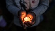 People attend a candle light vigil in memory of George Floyd and others who were killed by police on June 7, 2020 in Minneapolis, Minnesota. Stephen Maturen/Getty Images/AFP