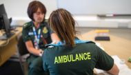 A paramedic takes a blood sample from a medical worker, during an antibody testing program at the Hollymoor Ambulance Hub of the West Midlands Ambulance Service, operated by the West Midlands Ambulance Service NHS Foundation Trust, in Birmingham, Britain 