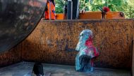 A bust of Belgium former king Leopold II that has been daubed with red paint is removed by a city worker in Auderghem, near Brussels on June 12, 2020 as several statues of the late monarch, a symbol of Belgium's bloody history as colonial power in central