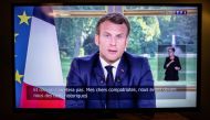 French President Emmanuel Macron is seen on a television screen in Paris on June 14, 2020 as he addresses the nation from the Elysee Palace during a televised speech, broadcast by French tv channel TF1. / AFP / Thomas Samson 