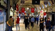 FILE PHOTO: People wearing protective face masks walk at Grand Bazaar as it reopens after weeks of the close doors amid the spread of the coronavirus disease (COVID-19), in Istanbul, Turkey, June 1, 2020. REUTERS/Umit Bektas/File Photo
