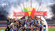 Napoli players and staff celebrate with the trophy after winning the Coppa Italia, as play resumes behind closed doors following the outbreak of the coronavirus disease (COVID-19) REUTERS/Alberto Lingria