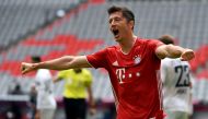 Bayern Munich's Polish forward Robert Lewandowski celebrates after scoring his team's second goal during the German first division Bundesliga football match FC Bayern Munich v SC Freiburg on June 20, 2020 in Munich, southern Germany AFP 