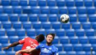 Union Berlin's Nigerian forward Anthony Ujah (L) and Hoffenheim's Bosnian defender Ermin Bicakcic both jump to head the ball during the German first division Bundesliga football match TSG 1899 Hoffenheim v FC Union Berlin on June 20, 2020 in Sinsheim, sou