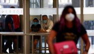 People wait for their family members at the arrivals area of the Adolfo Suarez Barajas airport, as Spain reopens its borders to visitors from most European countries after the coronavirus lockdown, in Madrid, Spain, June 22, 2020. REUTERS/Susana Vera
