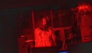 This picture taken on June 15, 2020 shows actress Asami Takeuchi, 33, performing during a murder scene at a demonstration of a haunted house at a garage in Tokyo. AFP / Philip Fong 