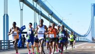 (FILES) In this file photo runners cross the Verrazzano-Narrows Bridge during the 2019 TCS New York City Marathon in New York on November 3, 2019. New York's famed marathon planned for November 1, 2020 has been cancelled due to the coronavirus pandemic, o