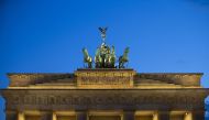 The historical Brandenburg Gate is seen as an entertainment crew performs a light show in Berlin, Germany on June 22, 2020.  Abdulhamid Ho?ba? - Anadolu