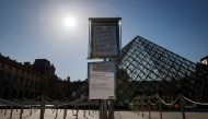 A picture taken on June 23, 2020 shows the Louvre pyramid by Chinese architect Ieoh Ming Pei, and the Louvre Museum in Paris.  / AFP / THOMAS SAMSON
