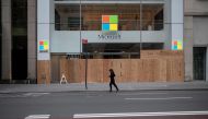 (FILES) In this file photo taken on June 2, 2020 A looted and boarded up Microsoft store is seen after a night of protest over the death of an African-American man George Floyd in Minneapolis in Manhattan in New York City. / AFP / Johannes EISELE
