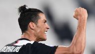 Juventus' Portuguese forward Cristiano Ronaldo celebrates after scoring a penalty during the Italian Serie A football match Juventus vs Lecce played on June 26, 2020 behind closed doors at the Juventus stadium in Turin. AFP / Miguel MEDINA
