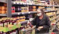 FILE PHOTO: An elderly woman wearing a face mask shops in a supermarket in Bad Honnef near Bonn, Germany, April 27, 2020. REUTERS/Wolfgang Rattay 
