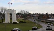 FILE PHOTO: Cars bound for the United States from Canada pass the Peace Arch border monument in Surrey, British Columbia, Canada February 16, 2017. REUTERS/Chris Helgren/File Photo
