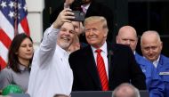 U.S. President Donald Trump poses for a selfie during a signing ceremony for the United States-Mexico-Canada Trade Agreement (USMCA) on the South Lawn of the White House in Washington, U.S., January 29, 2020. REUTERS/Jonathan Ernst/File Photo