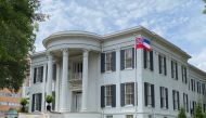 A Mississippi flag flies at the governor's mansion on the day Mississippi Governor Tate Reeves signs a bill into law replacing the current state flag that includes a Confederate emblem, in Jackson, Mississippi, U.S., June 30, 2020. REUTERS/Suzi Altman