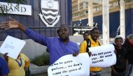Protesters attend a demonstration against the coronavirus disease (COVID-19) vaccine testing on Africans, at Wits University in Johannesburg, South Africa, July 1, 2020. REUTERS/Siphiwe Sibeko
