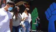 :People wearing masks visit the Hollywood Walk of Fame in Hollywood, California June 30, 2020. Due to a spike in coronavirus cases California Gov. Gavin Newsom ordered the closure of bars in Los Angeles and six other California counties in order to stem t