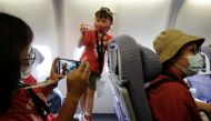 People who want to leave the island, but cannot due to coronavirus disease-related (COVID-19) travel restrictions, take part in a 