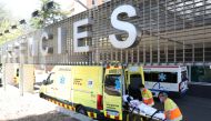 A woman is carried on a stretcher at Arnau de Vilanova hospital, after Catalonia's government imposed new restrictions in an effort to control a new outbreak of the coronavirus disease (COVID-19), in Lleida, Spain July 4, 2020. Reuters/Nacho Doce