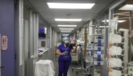 Chilean nurse Damaris Silva plays the violin for patients suffering from the coronavirus disease (COVID-19) in the Intensive Care Unit (ICU) of the El Pino de San Bernardo hospital, in Santiago, Chile, July 2, 2020. REUTERS/Pablo Sanhueza
