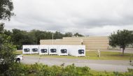 TAMPA, FL - JULY 06: Six refrigerator trailers sit outside of the Hillsborough County Medical Examiners Office on July 6, 2020 in Tampa, Florida. Florida is experiencing another surge in COVID-19 cases after reopening in early June, with cases surpassing 