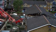 A collapsed crane is seen near a construction site in Bow, east London, Britain, July 8, 2020. REUTERS/Hannah McKay
